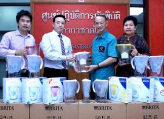 Dr. Manu Leenawong (2nd left), MD Aqua Innotech (Thailand) Co., Ltd., together with GM Suradej Darayen (left), donate 60 Brita Water Filters valued at 101,400 baht to Lt. Gen Dr. Amnat Barlee (2nd right), director and Miss Assara Petkong (right), the vice director of the Thai Red Cross Relief and Community Health Bureau for use in emergencies in aid of flood victims throughout Thailand.